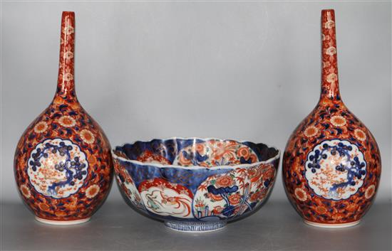 A pair of Imari bottle vases and a bowl